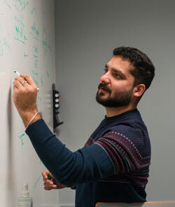 Person writing on a whiteboard