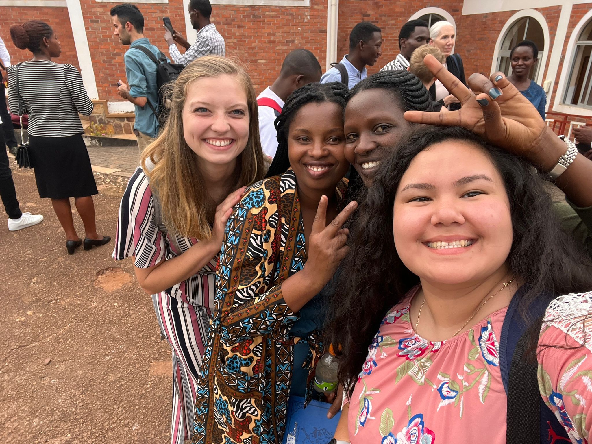 Students and Rwandans smiling during Mercer On Mission