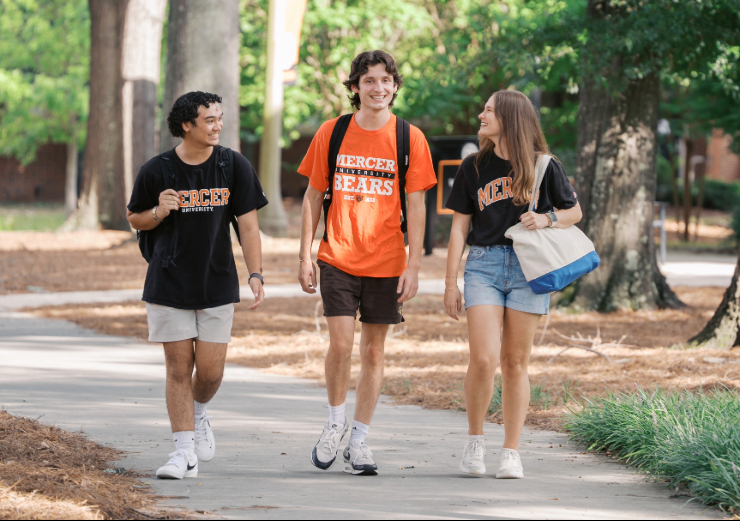 three students walking outside