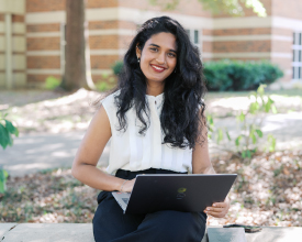 MSBA Student Sitting outside studying